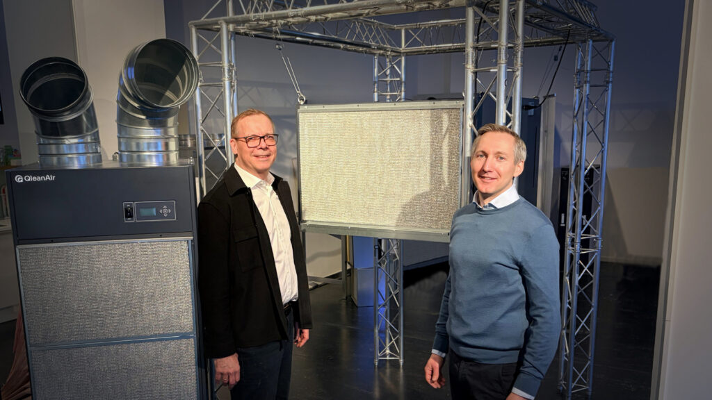 sebastian lindström and johan billing in front of qleanair fs 60 and fs 70 oil mist air cleaners